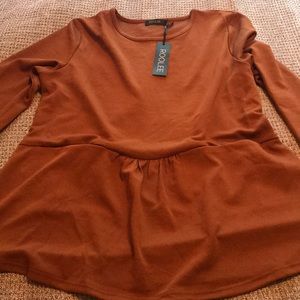 Roolee peplum top with front pockets
